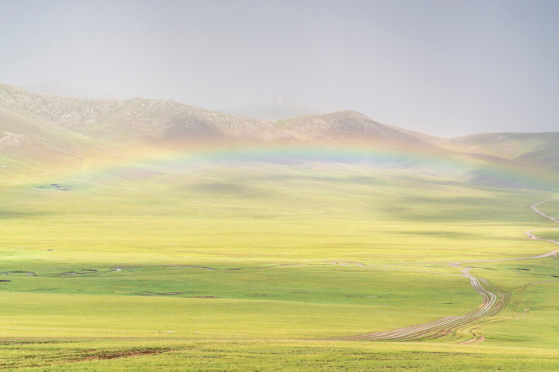 Rainbow over the green Mongolian steppe, Ovorkhangai province, Mongolia, Central Asia, Asia