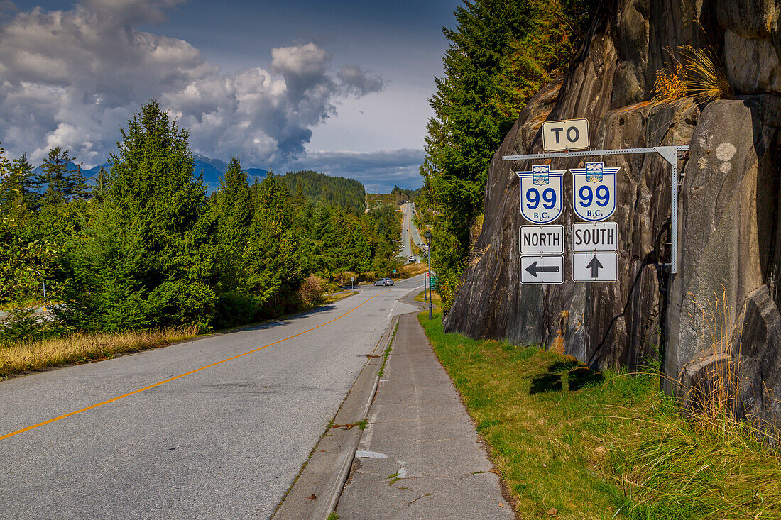 View of The Sea to Sky Highway and signpost near Squamish, British Columbia, Canada, North America