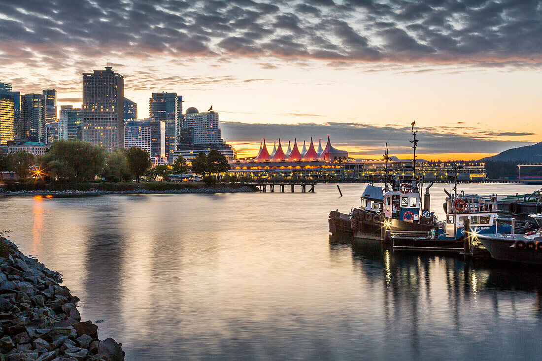View of Canada Place and urban office buildings at sunset from CRAB Park, Vancouver, British Columbia, Canada, North America