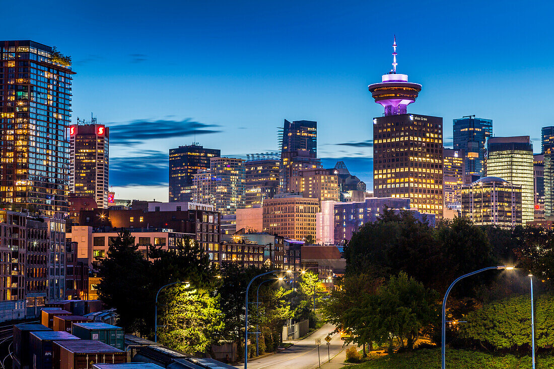 View of city skyline and Vancouver Lookout Tower at dusk from Portside, Vancouver, British Columbia, Canada, North America