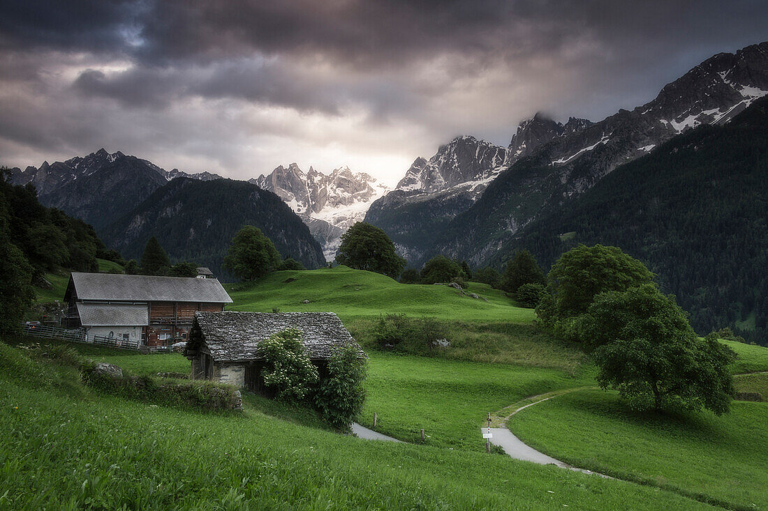 Clouds at dawn, Soglio, Bregaglia Valley, Maloja Region, Canton of Graubunden (Grisons), Switzerland, Europe
