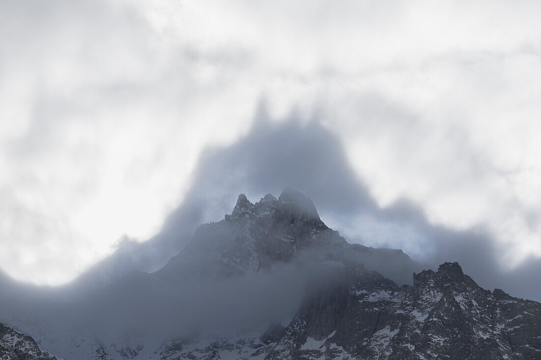 Shapes above peaks created by mist, Cime Del Largo, Bregaglia Valley, Canton of Graubunden (Grisons), Switzerland, Europe