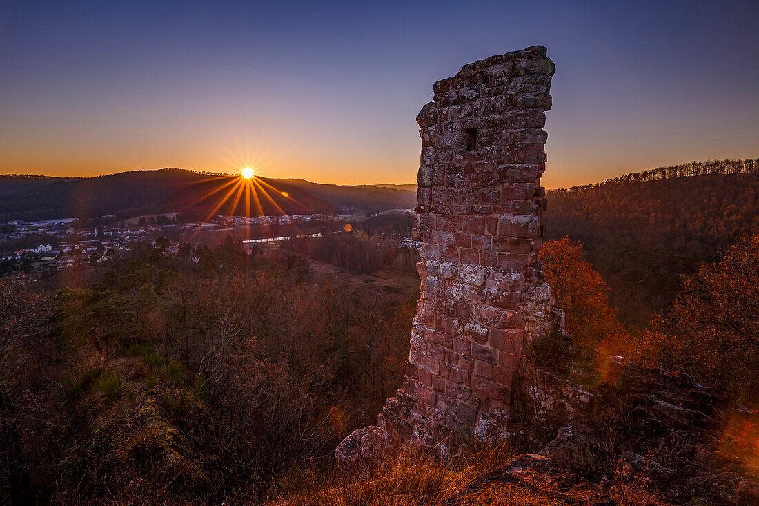 Sunset over the Chateau de Ramstein, a ruined castle in the commune of Baerenthal, in the Moselle region, France, Europe