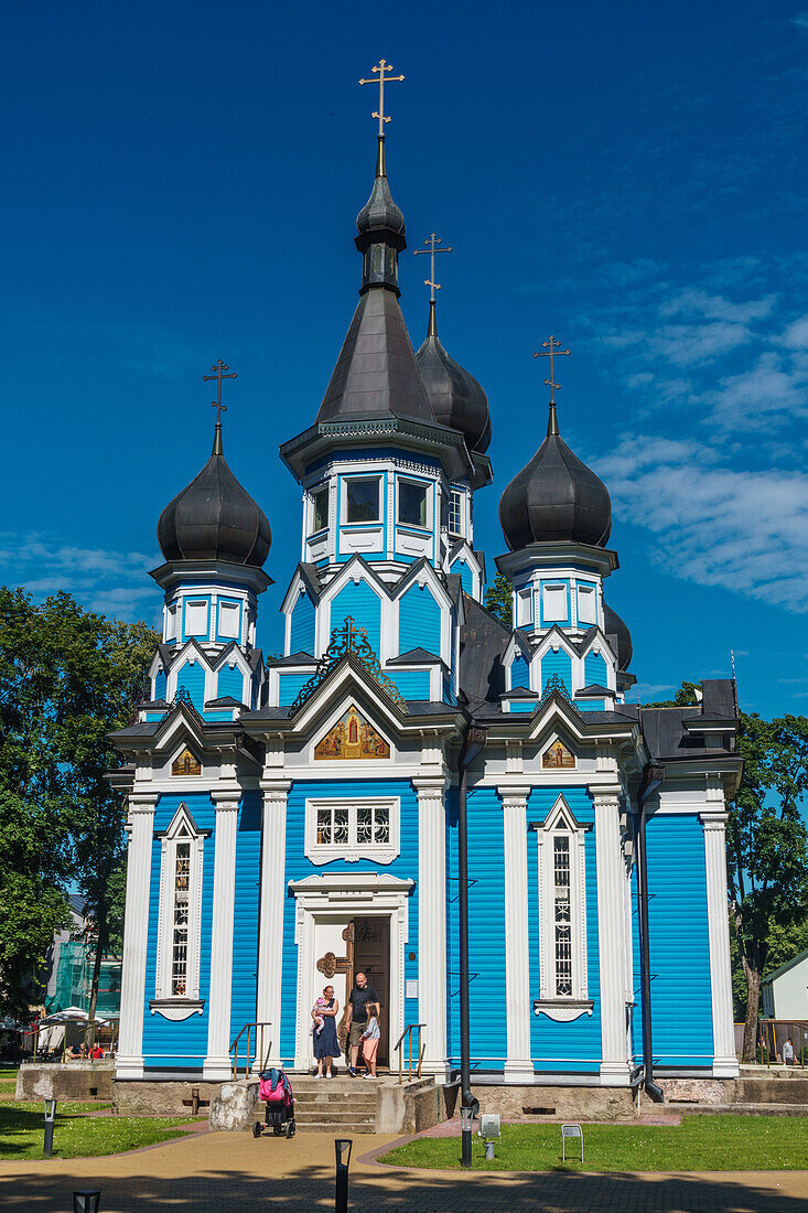 Family leaving Russian Orthodox Church at Drushkinkai, a spa town, Southern Lithuania, Europe