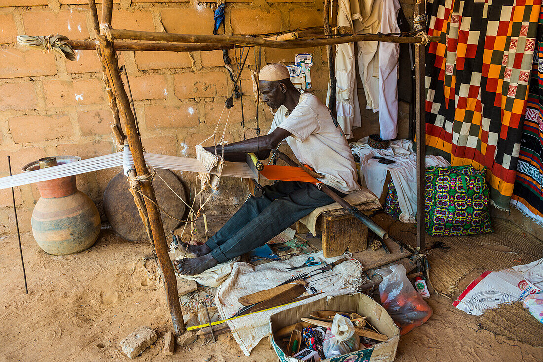 Man weaving on a traditional loom in the National Museum, Niamey, Niger, Africa