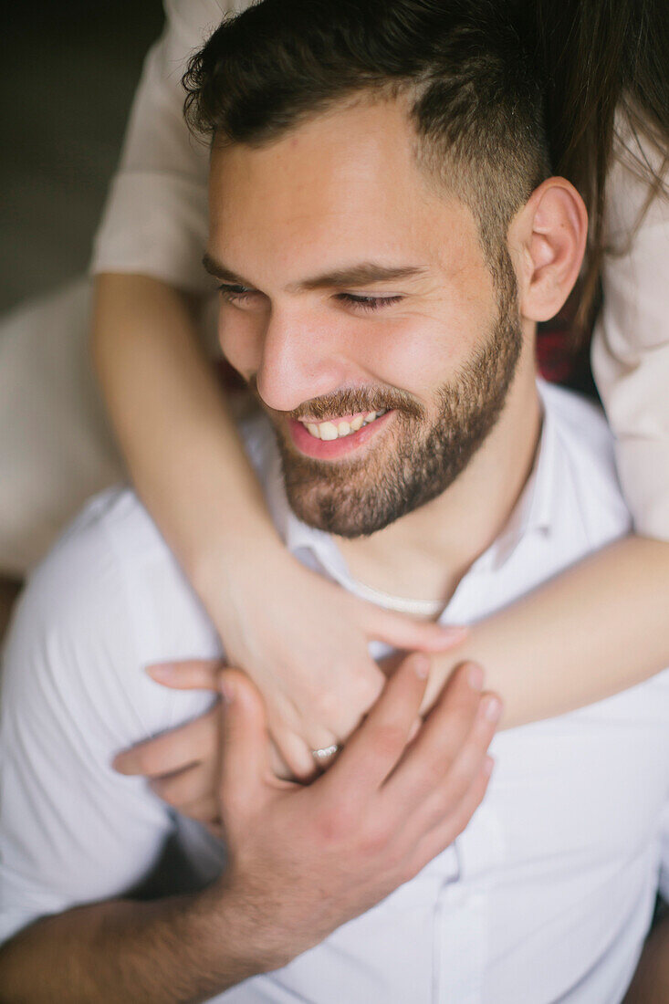 Caucasian woman hugging smiling man