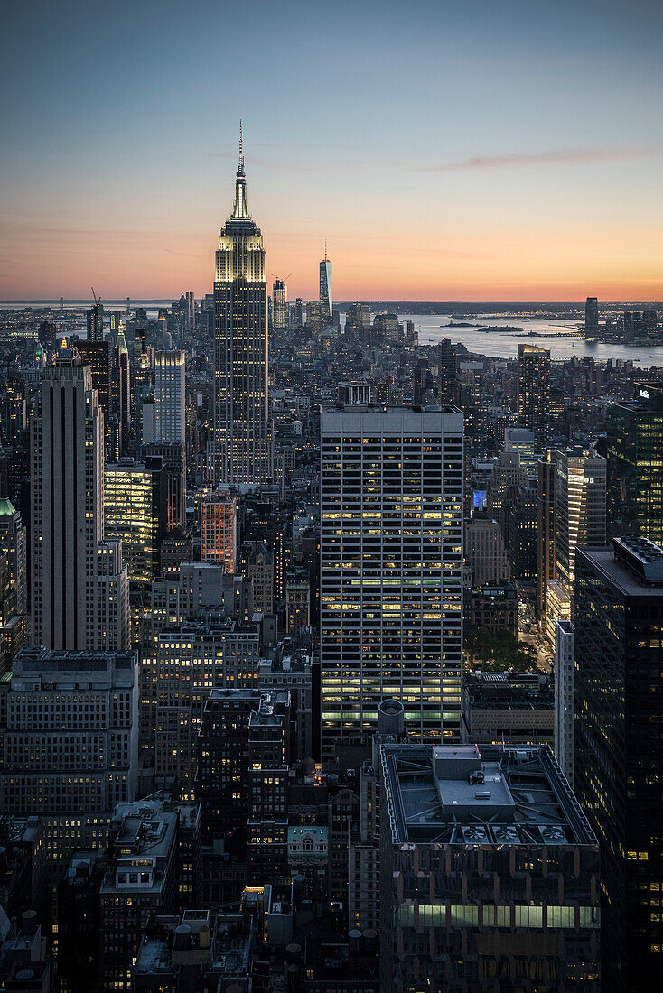Top of the Rock view to the Empire State Building, ONE World Trade Center, Times Square and Liberty Island at dusk, Rockefeller Center, Manhattan, NYC, New York City, United States of America, USA, North America