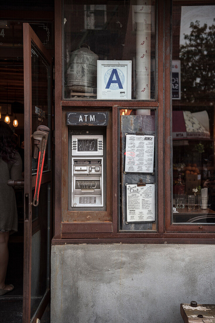 ATM at the entrance of a bar, Williamsburg, Brooklyn, NYC, New York City, United States of America, USA, North America