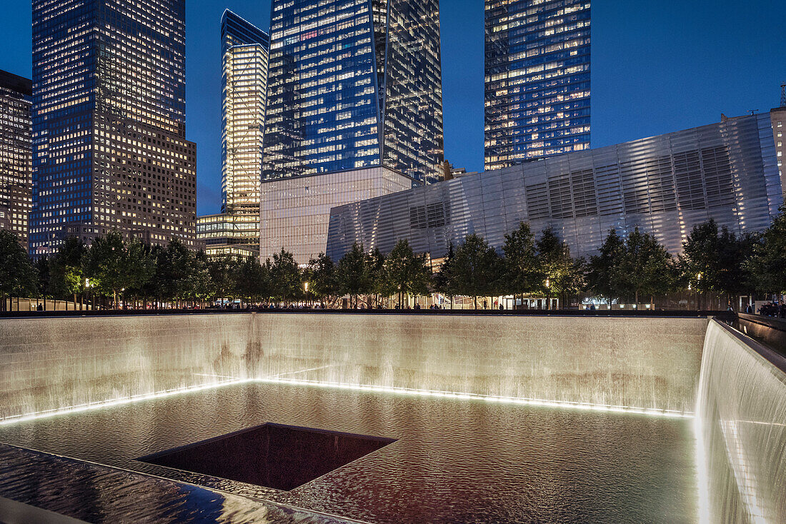 One World Trade Center tower and base basin of the collapsed 9/11 World Trade Center at night, WTC Memorial, Manhattan, NYC, New York City, United States of America, USA, North America
