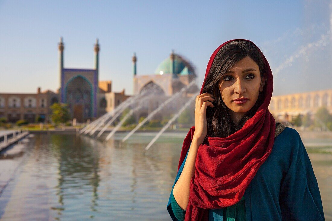 Iranian woman in front of the Shah mosque, Esfahan, Iran, Asia