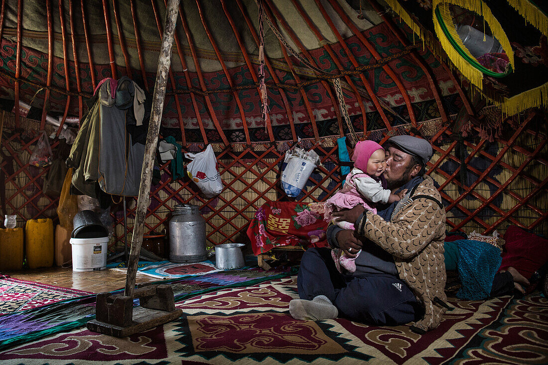 Kyrgyz family in yurt, Kyrgyzstan, Asia