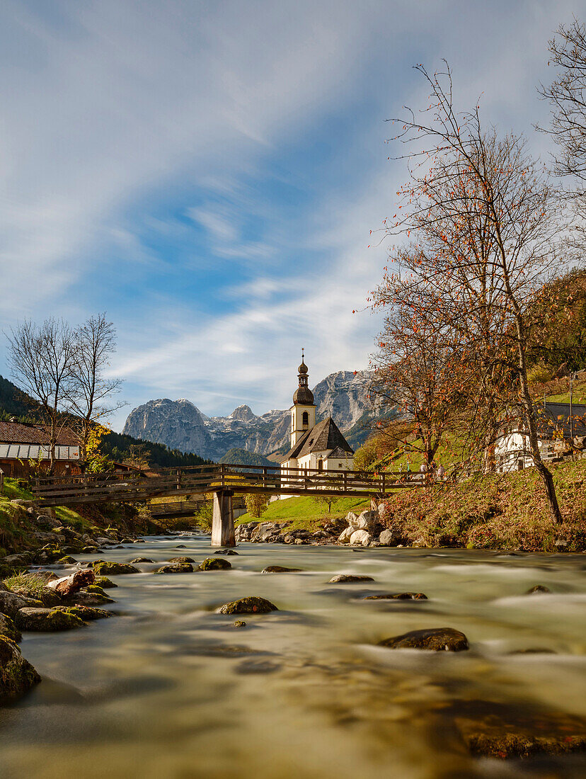 View of Ertlsteg and the parish church of St. Sebastian on the Ramsauer Ache, in the background the Reiter Alm, Ramsau, Upper Bavaria, Germany