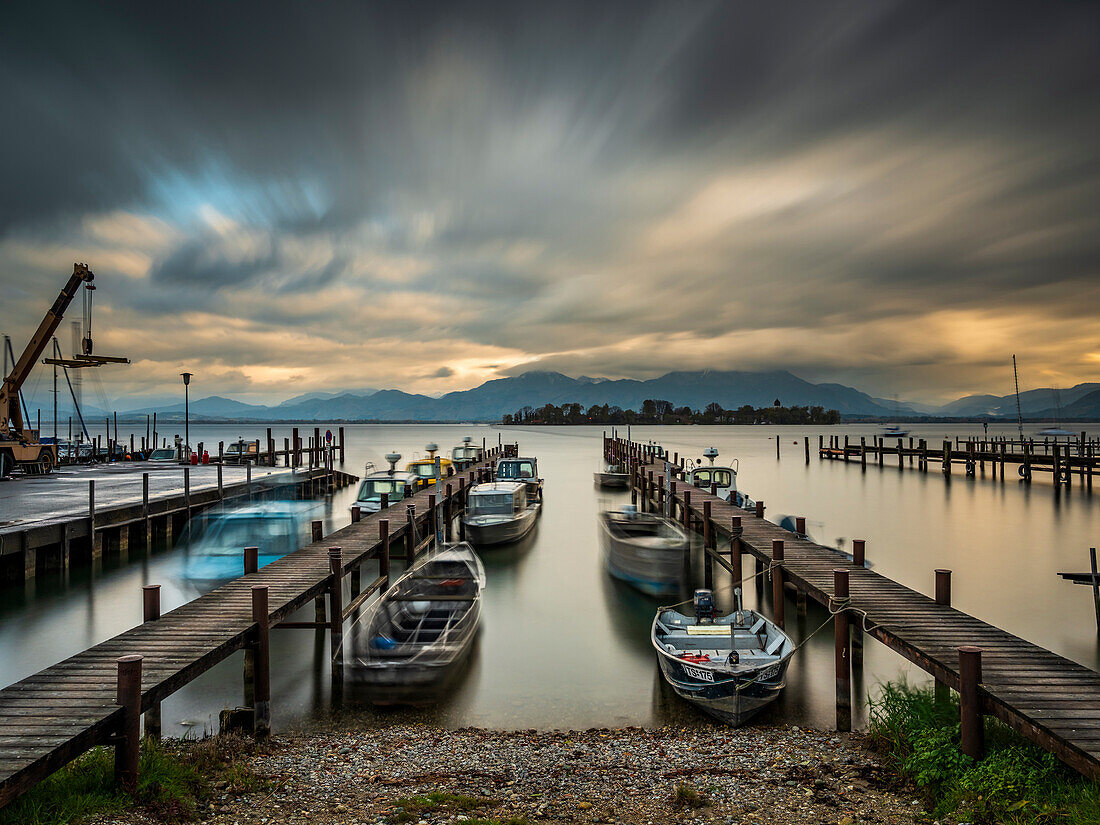 Autumn mood at the port of Gstadt with a view of the Fraueninsel and the Chiemgau Alps, Gstadt am Chiemsee, Upper Bavaria, Germany