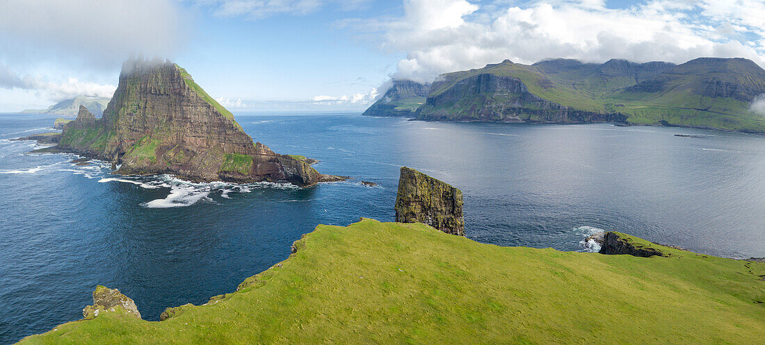 Panoramic of Drangarnir and Tindholmur islet, Vagar Island, Faroe Islands, Denmark, Europe (Drone)