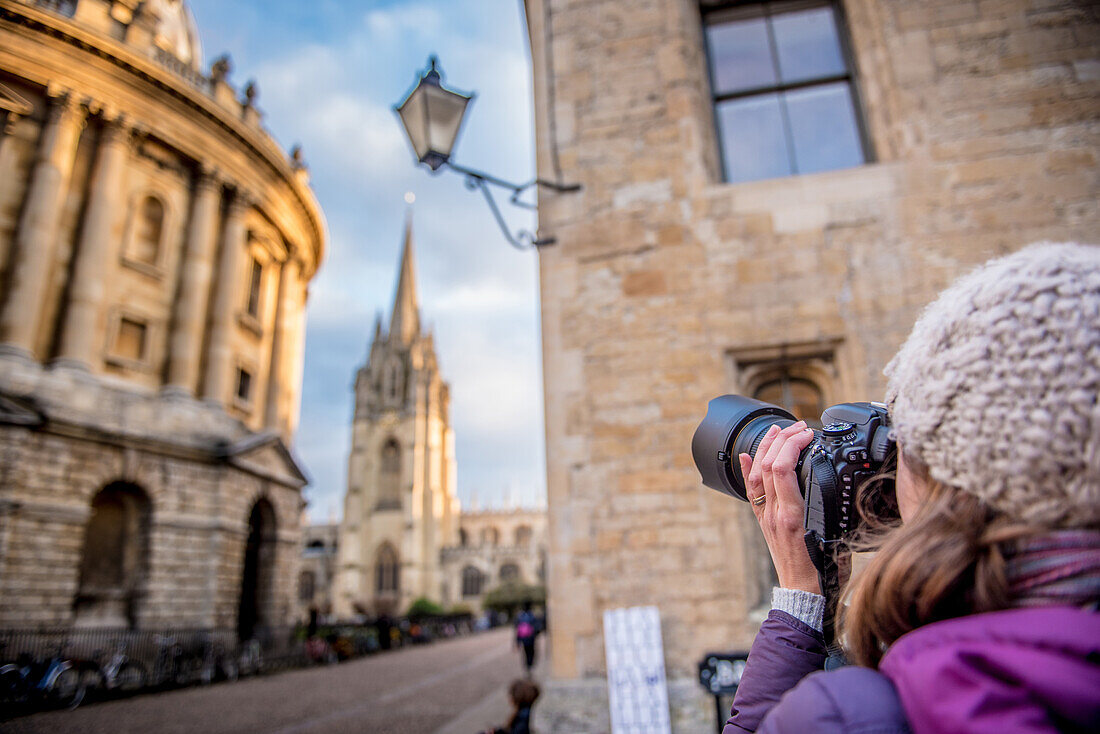 Photographer photographing St. Mary's Church and The Radcliffe Camera in Radcliffe Square, Oxford, Oxfordshire, England, United Kingdom, Europe