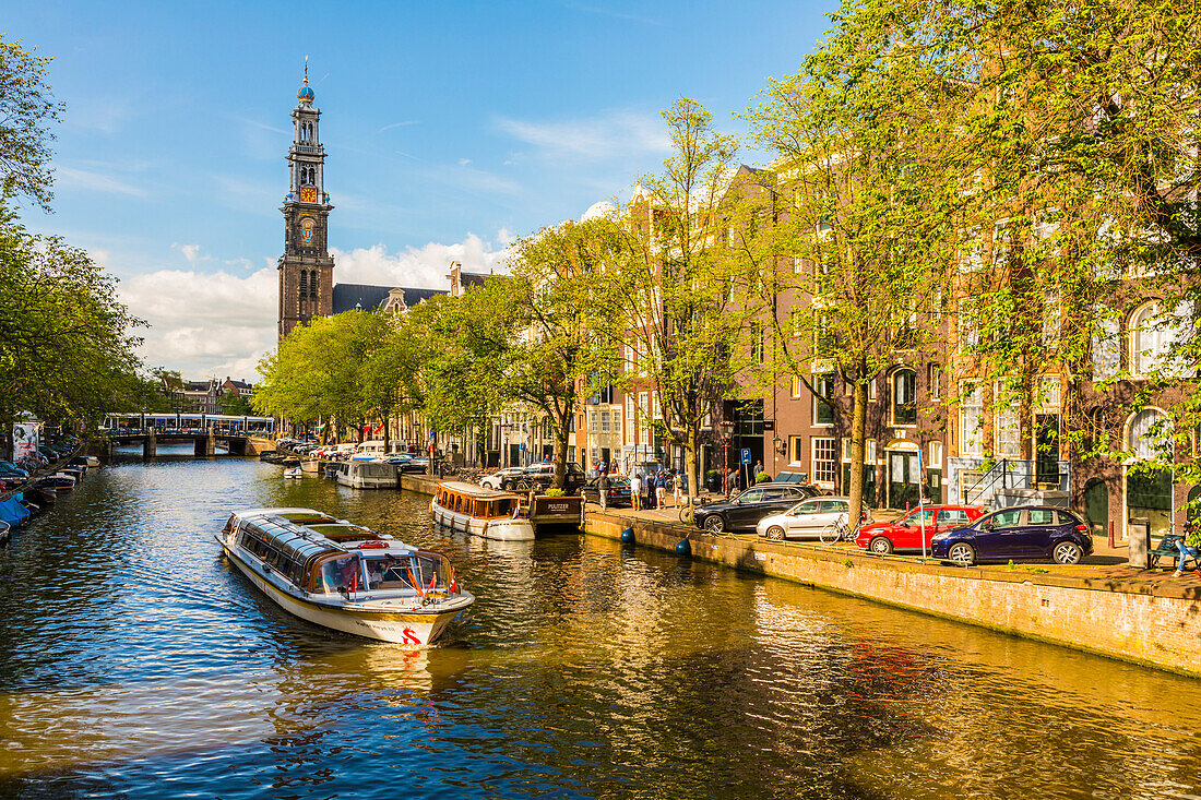 Boat on Prinsengracht Canal, with Westerkerk in the background, Amsterdam, Netherlands, Europe