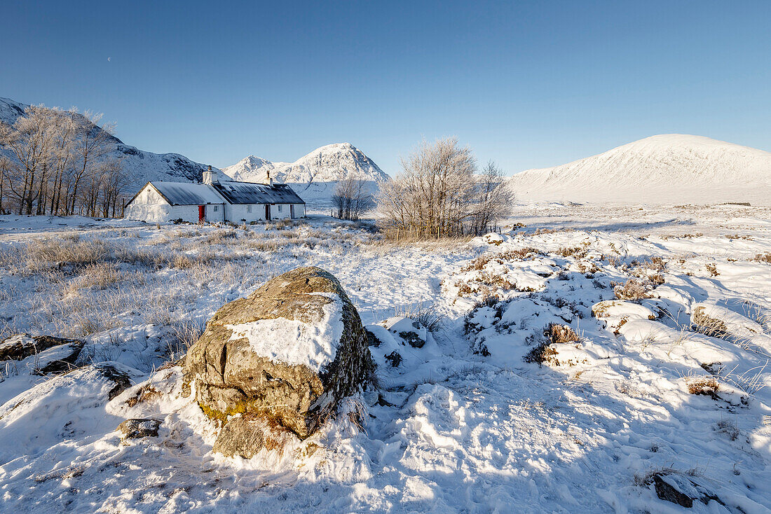 A wintery scene at Black Rock cottage and Buachaille Etive Mor on Rannoch Moor, Highlands, Scotland, United Kingdom, Europe