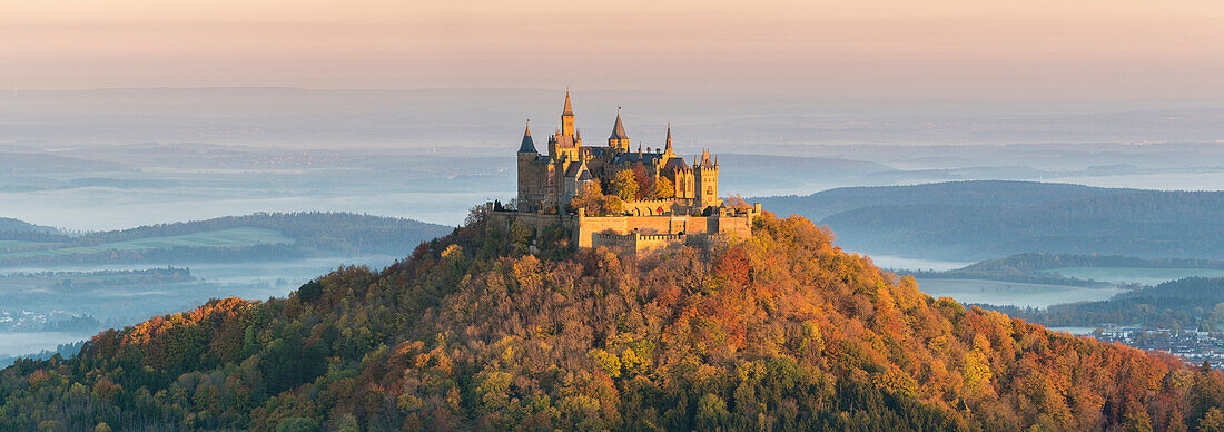 Hohenzollern Castle in autumnal scenery at dawn, Hechingen, Baden-Wurttemberg, Germany, Europe