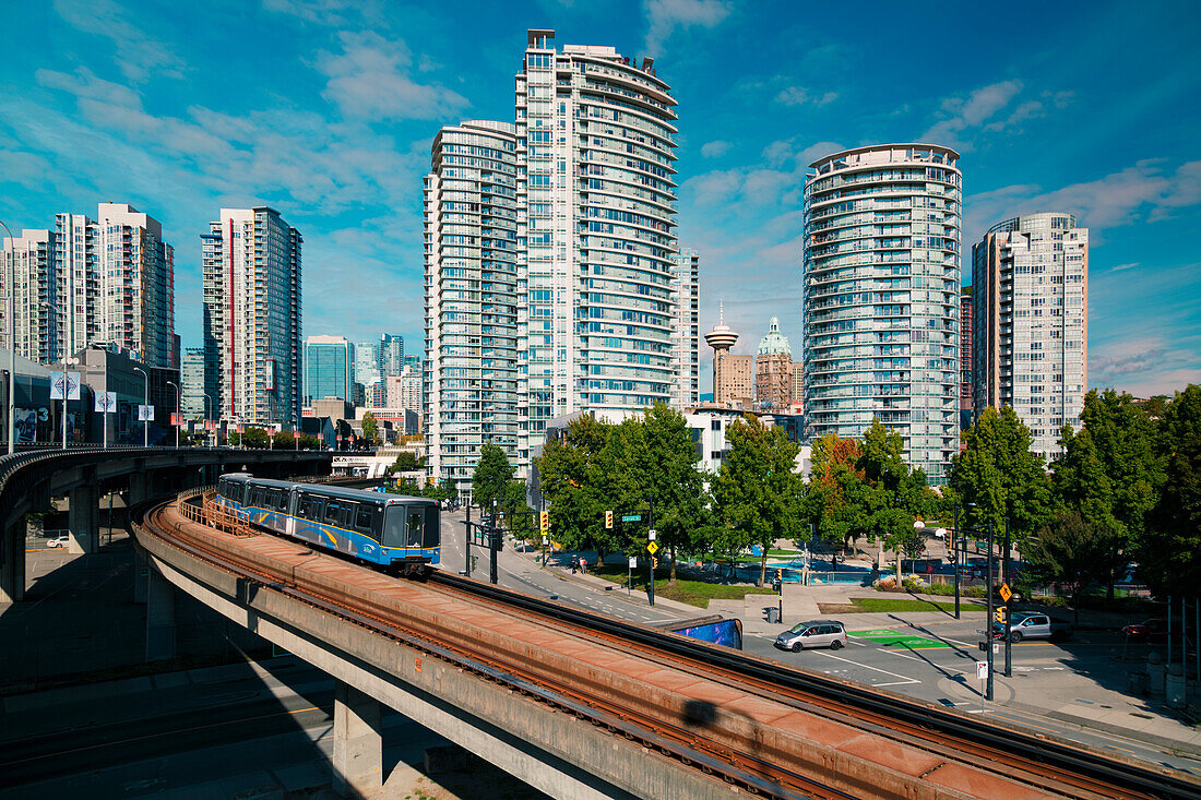 View of Sky Train and urban office blocks and apartments, Vancouver, British Columbia, Canada, North America