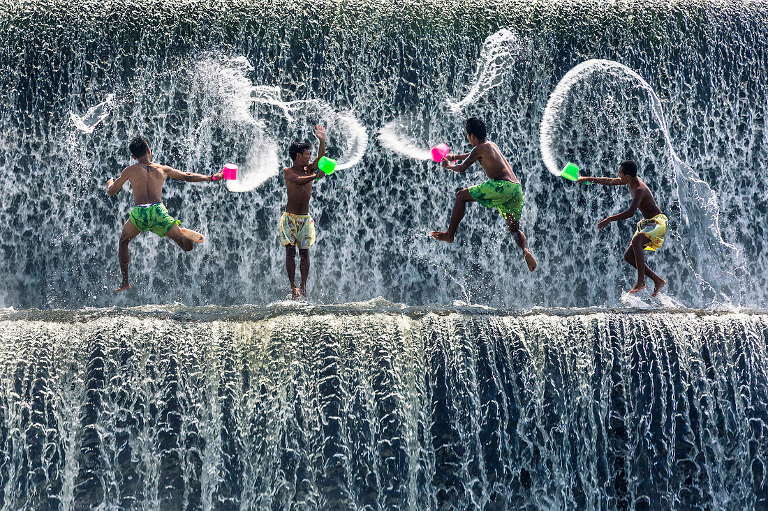 Boys water fight, Tukad Unda dam, Bali, Indonesia, Southeast Asia, Asia