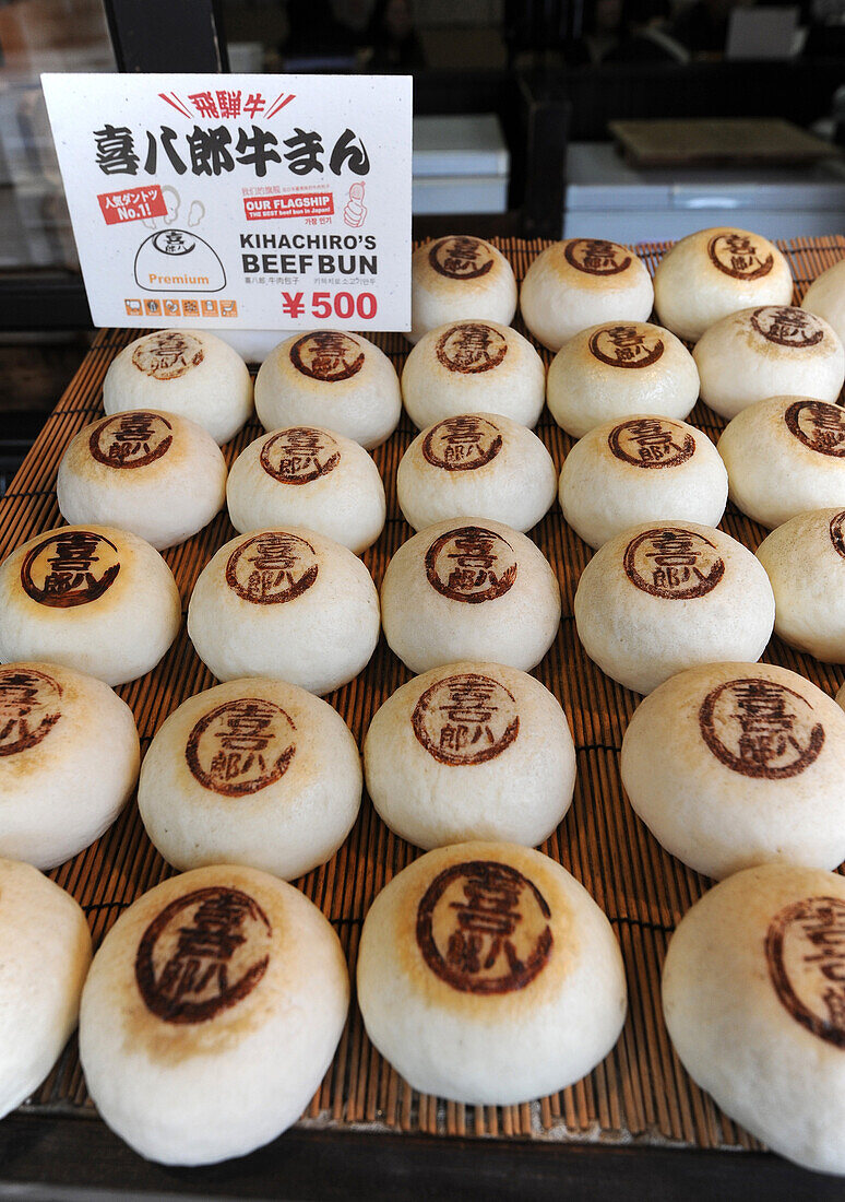 Beef buns, steamed, fluffy, soft buns with a succulent meat and vegetable filling, in fast food restaurant, Takayama, Japan, Asia