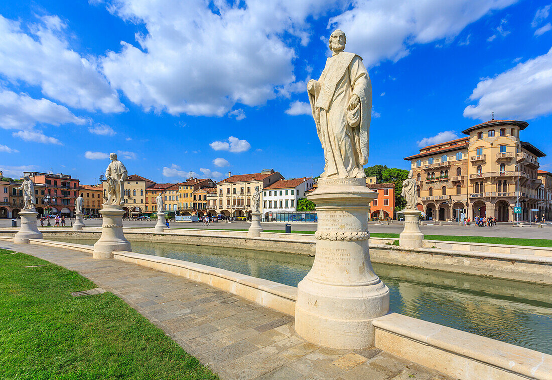 View of statues in Prato della Valle and colourful architecture  in the background, Padua, Veneto, Italy, Europe
