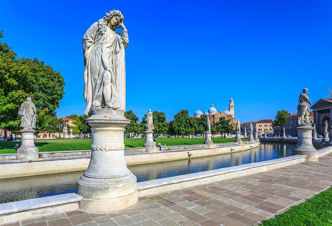 View of statues in Prato della Valle and Santa Giustina Basilica visible in background, Padua, Veneto, Italy, Europe