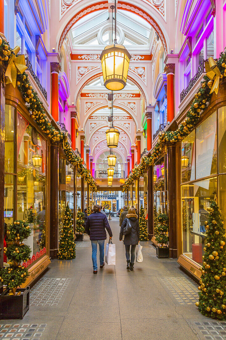 Christmas decorations and shoppers in The Royal Arcade, Mayfair, London, England, United Kingdom, Europe