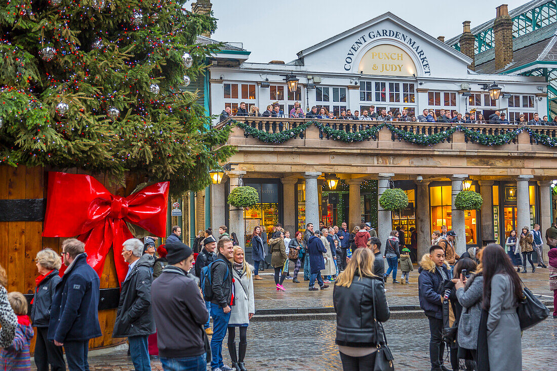 Visitors and Christmas decorations in Covent Garden Market, London, England, United Kingdom, Europe