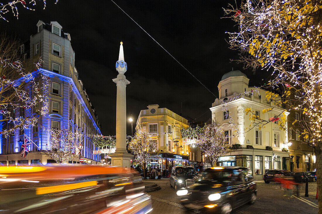 View of traffic at Seven Dials at night, London, England, United Kingdom, Europe