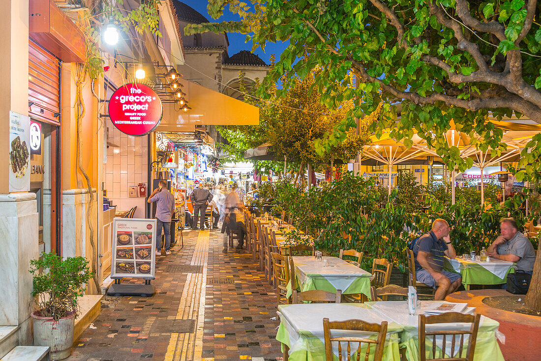 View of Greek restaurants in Monastiraki Square at dusk, Monastiraki District, Athens, Greece, Europe