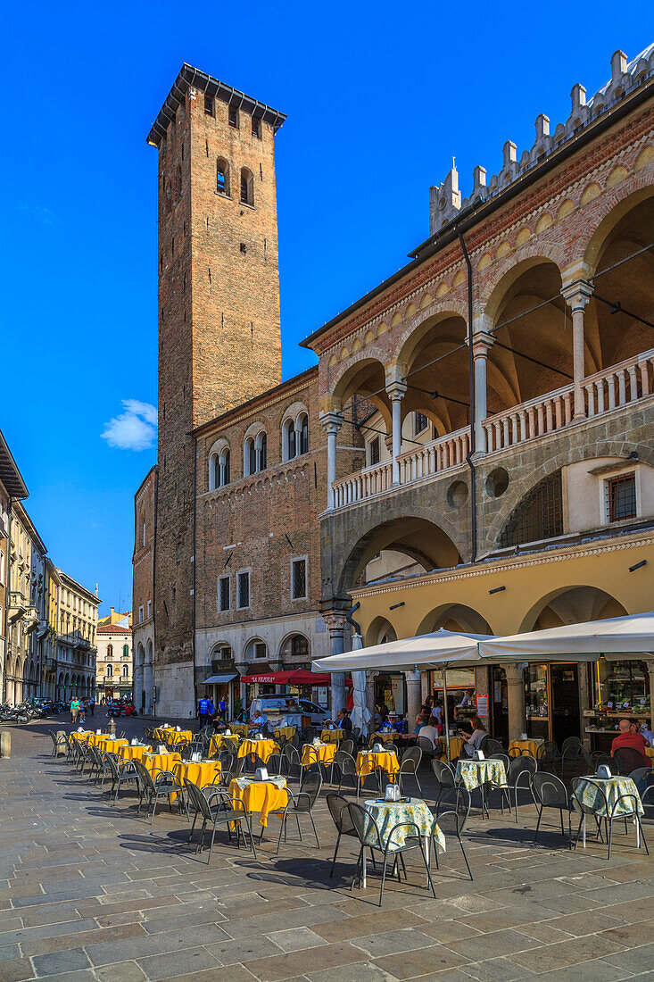Cafes and Tower of Anziani in Piazza della Frutta, Ragione Palace is visible, Padua, Veneto, Italy, Europe