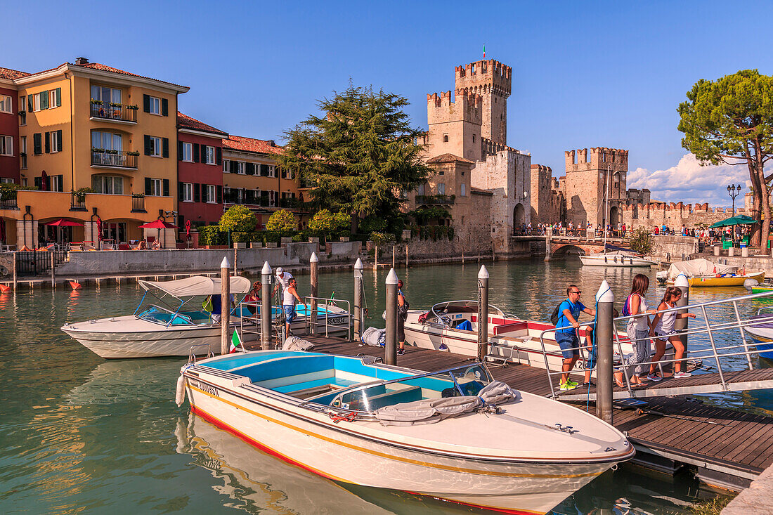 View of Scaliger Castle and boats in harbour, Sirmione, Lake Garda, Lombardy, Italian Lakes, Italy, Europe
