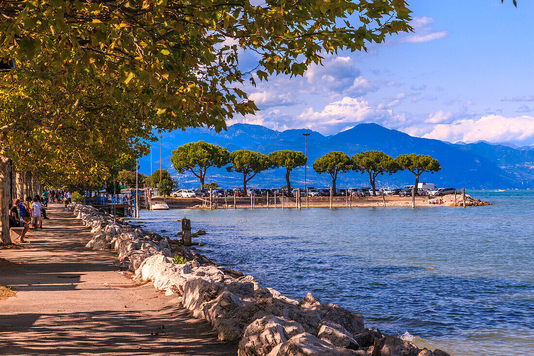 View of lakeside walk and Lake Garda Sirmione del Garda, Lake Garda, Lombardy, Italian Lakes, Italy, Europe