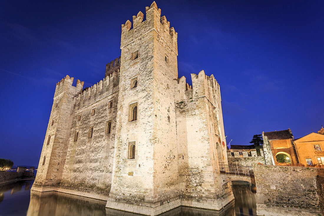 View of Scaliger Castle illuminated at night, Sirmione, Lake Garda, Lombardy, Italian Lakes, Italy, Europe