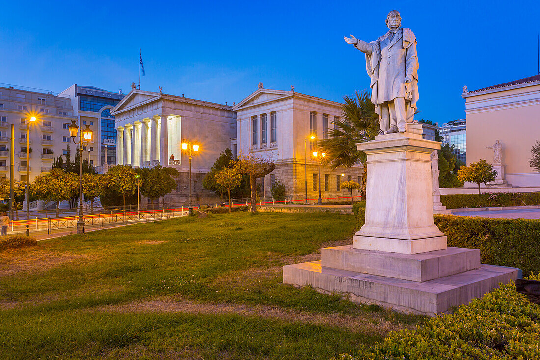 View of the statue and National Library of Greece at dusk, Athens, Greece, Europe