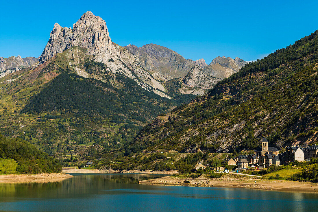 Lanuza lake and village and Pena Foratata peak in the scenic upper Tena Valley, Sallent de Gallego, Pyrenees, Huesca Province, Spain, Europe