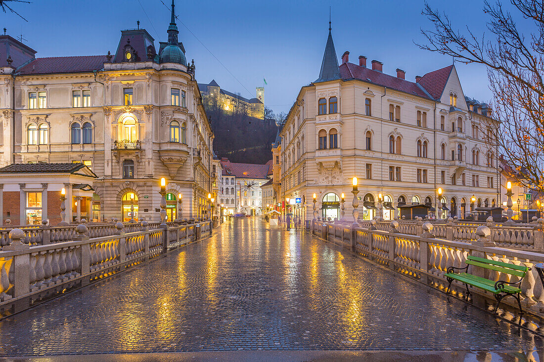 View from Plaza Presernov over Triple Bridge toward Ljubljana Castle, Ljubljana, Slovenia, Europe