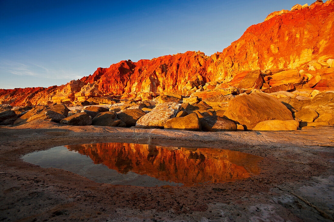 The red rocky coastline of Cape Leveque after sunset