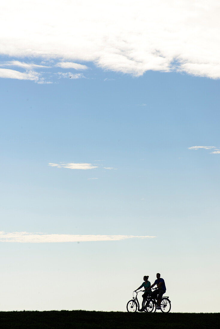 Cyclist on the dike, Zingst, Ostseekueste, Mecklenburg-Vorpommern Germany