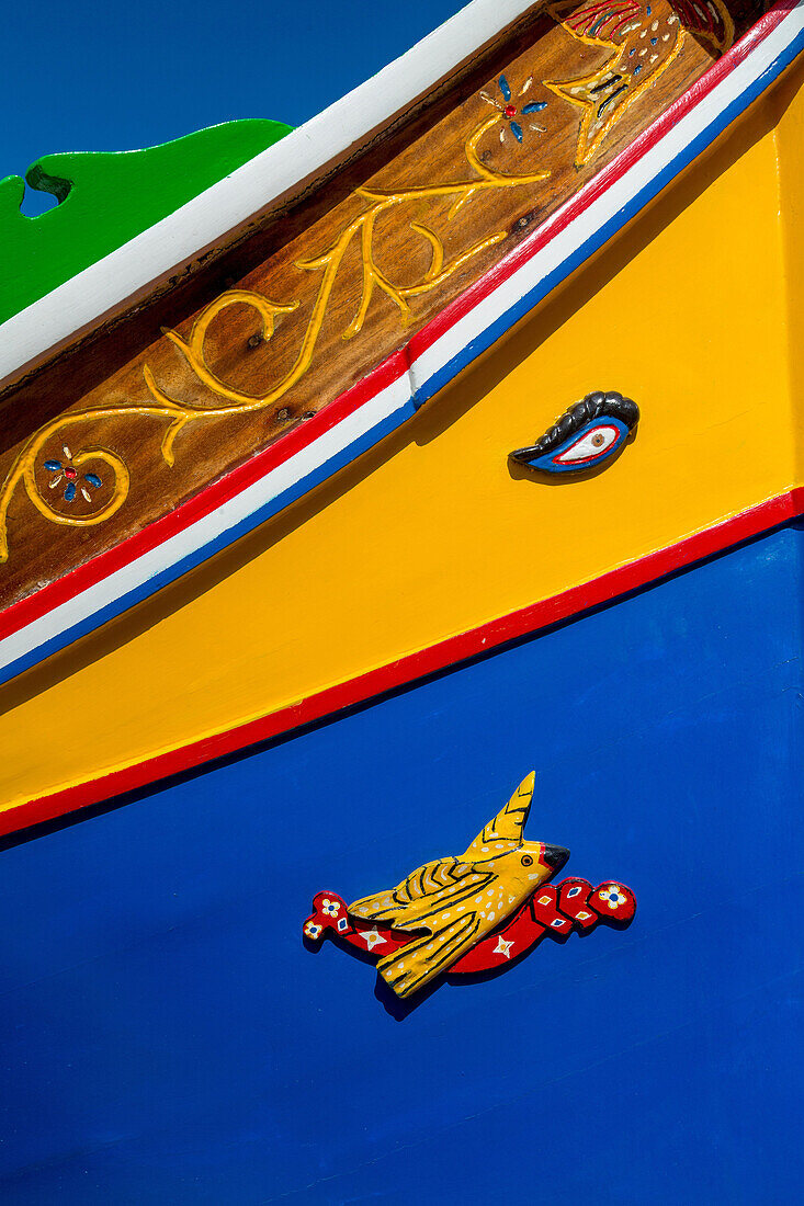 Detail of traditional brightly painted fishing boat in the harbour at Marsaxlokk, Malta, Mediterranean, Europe