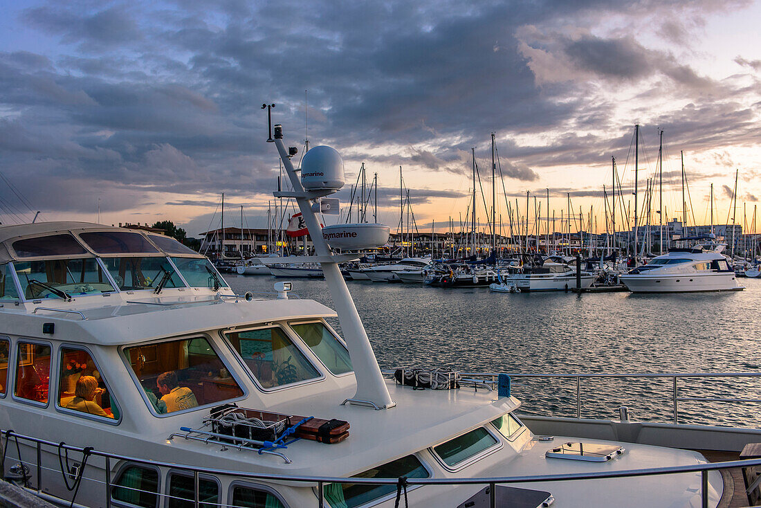 Motor yacht in the evening light in the marina, Kühlungsborn, Ostseeküste, Mecklenburg-Western Pomerania Germany