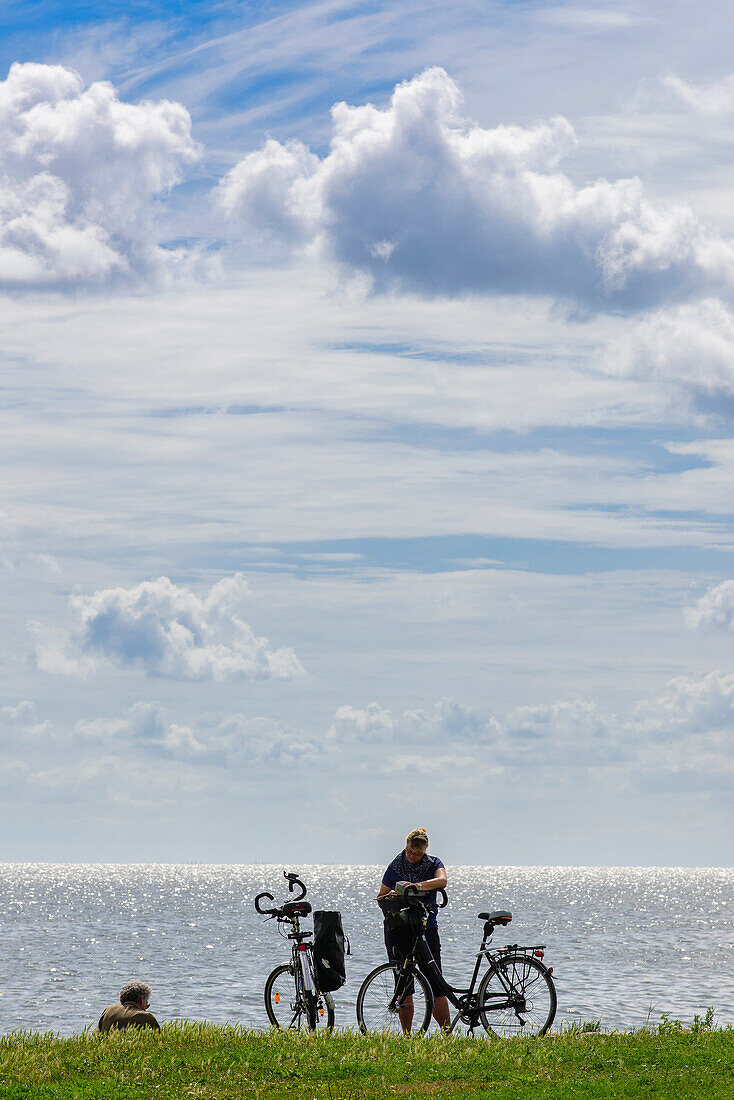 Cyclists take a break at Szczecin Lagoon, Usedom, Baltic Sea Coast, Mecklenburg-Vorpommern, Germany