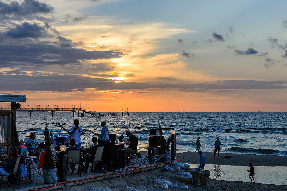 Beach bar with music band and sunset from Miedzyzdroje, Wollin island, Baltic Sea coast, Poland