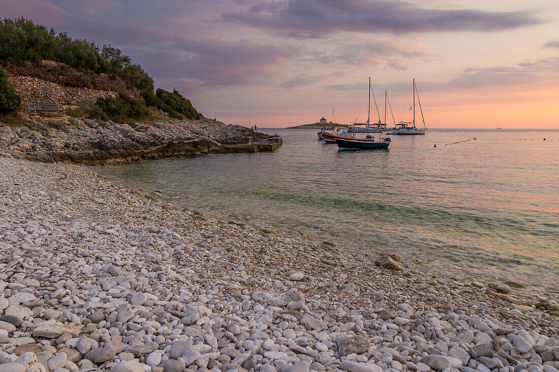 Boats anchoring at Pokonji Dol Beach near Hvar Town at sunset, Hvar, Croatia, Europe