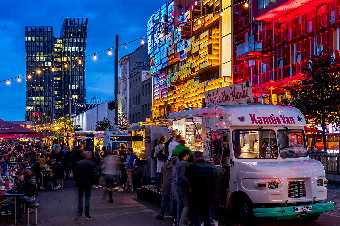 Food truck festival at the Spielbudenplatz near Reeperbahn at dusk, Hamburg, Germany, Europe