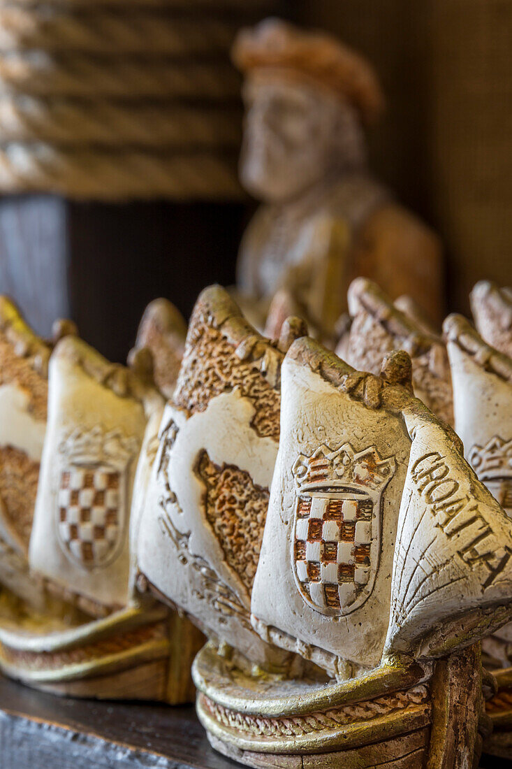 Typical souvenirs in a Marco Polo Shop in Korcula Town, the supposed birthplace of Marco Polo, Korcula, Croatia, Europe