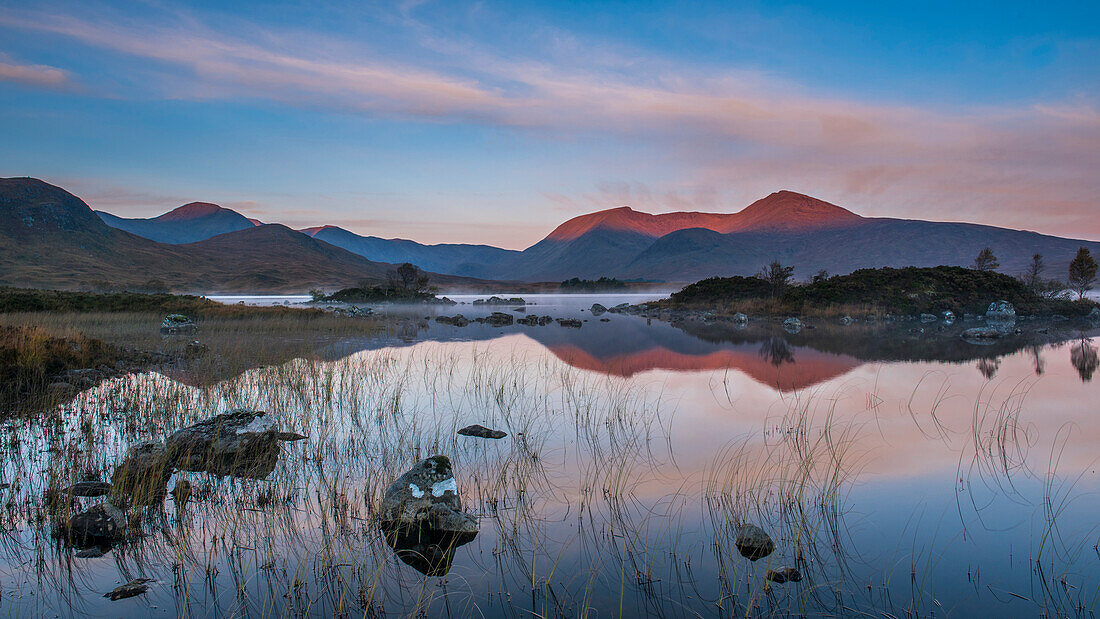 Lochan na h-Achlaise with the early morning light catching the Black Mount in the background, Rannoch Moor, Highlands, Scotland, United Kingdom, Europe