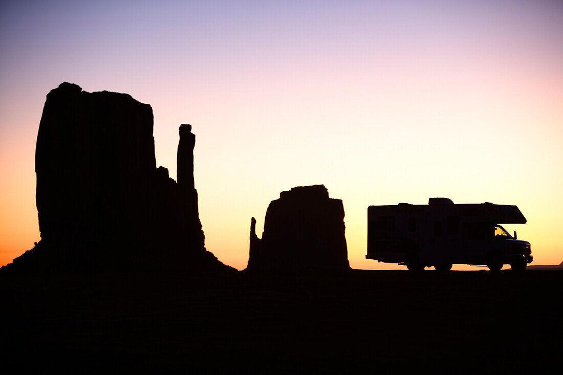 Silhouette of a motor home parked at dawn in the Monument Valley, Arizona, Utah.