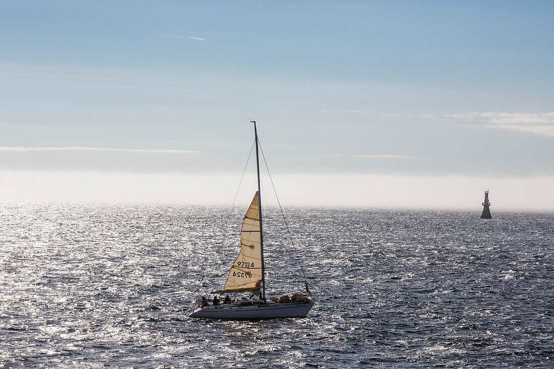 Sailboat sailing on waters of Desolation Sound, Cortes Island, British Columbia, Canada